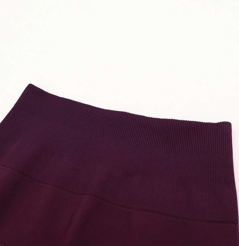 Close-up of women's high waist gradient seamless leggings for yoga in deep purple.